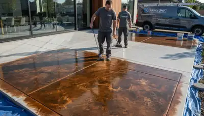Concrete staining on residential patio by professional painters in Ogden, UT for durable floor finish