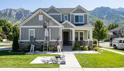 Professional house painters in Ogden UT completing exterior home painting project