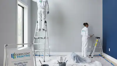 Professional interior house painters working in Ogden, UT, applying fresh wall paint with smooth finish
